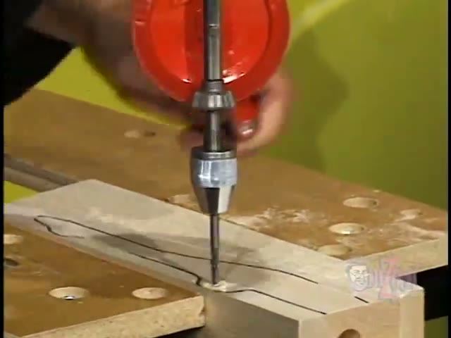 Drilling an axle hole in a clamped basswood dragster blank